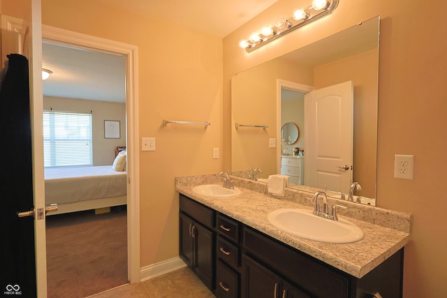 bathroom featuring tile patterned floors and vanity