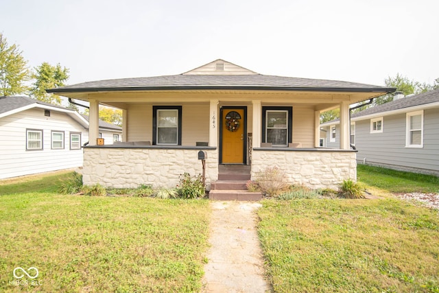 view of front of home featuring a porch and a front lawn