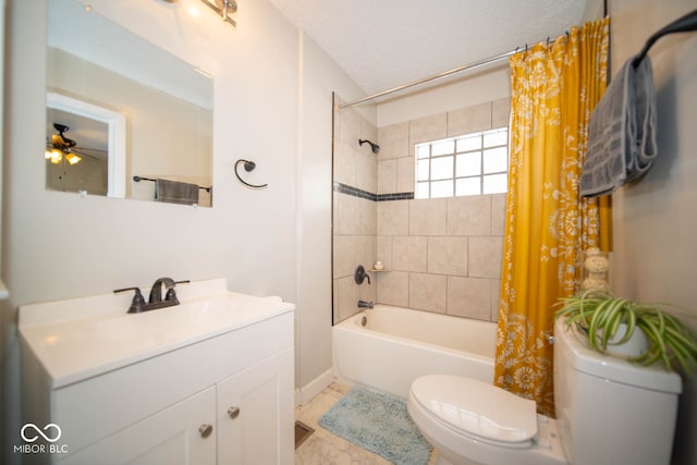 full bathroom with ceiling fan, toilet, shower / bath combo with shower curtain, vanity, and a textured ceiling