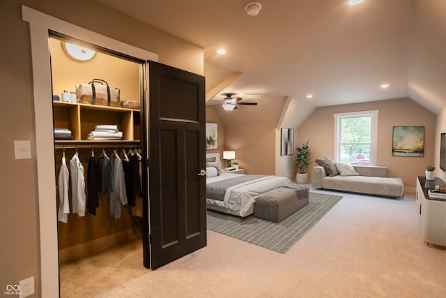 carpeted bedroom with lofted ceiling, ceiling fan, and a closet