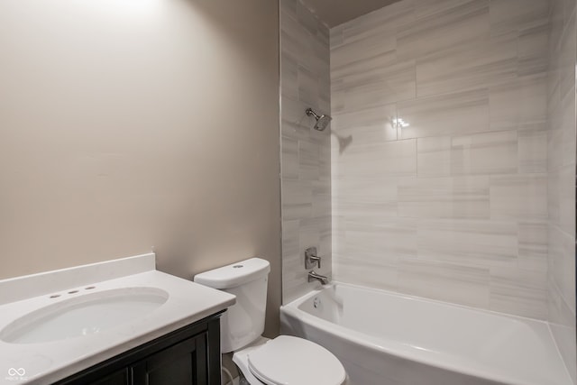 full bathroom featuring toilet, vanity, and tub / shower combination