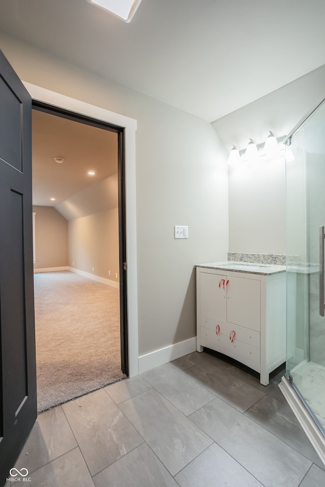 bathroom featuring vaulted ceiling