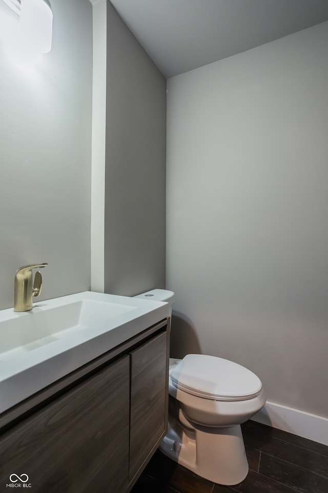 bathroom with toilet and vanity