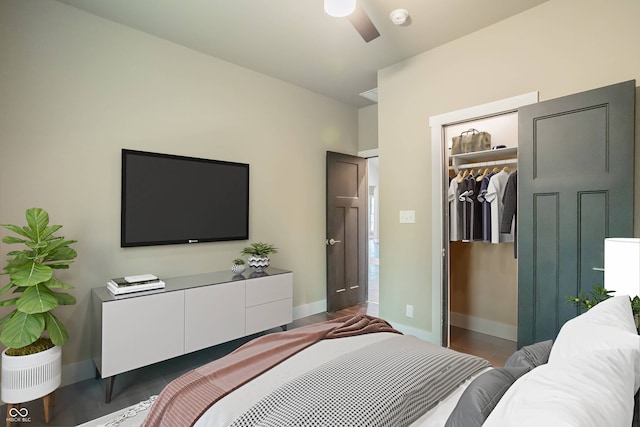 bedroom with ceiling fan, a closet, and a spacious closet