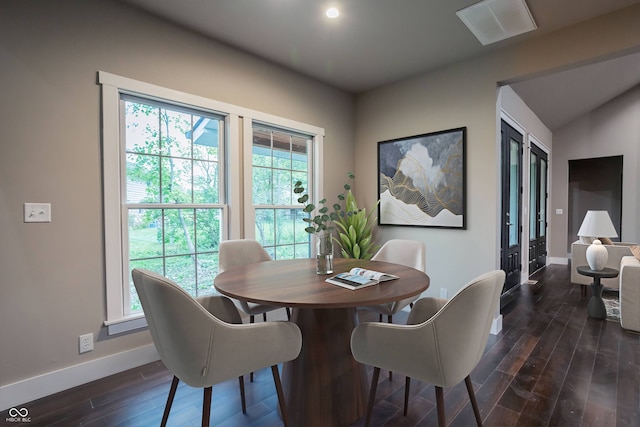 dining space featuring dark hardwood / wood-style floors