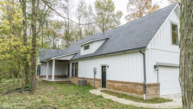 back of house featuring central air condition unit