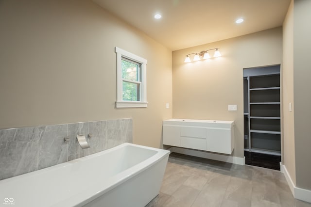 bathroom featuring a bathtub and vanity