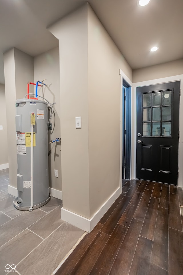 foyer entrance featuring water heater