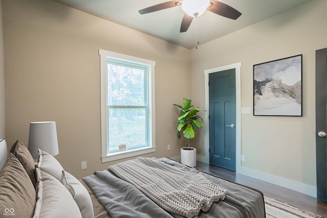 bedroom featuring ceiling fan and hardwood / wood-style flooring