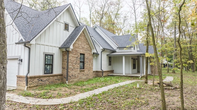 view of property exterior featuring covered porch