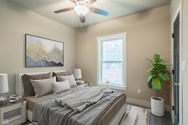 bedroom featuring ceiling fan and hardwood / wood-style flooring