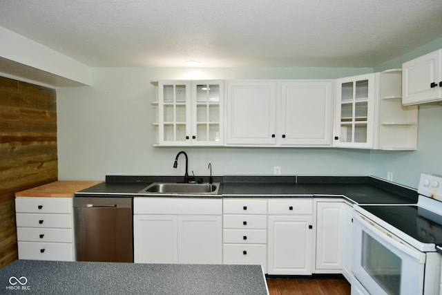 kitchen with electric range, dishwasher, sink, and white cabinets