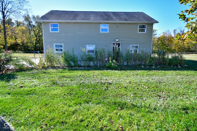 view of property exterior with a lawn