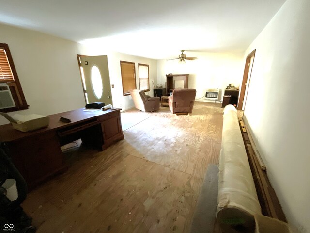 living room with light wood-type flooring and ceiling fan