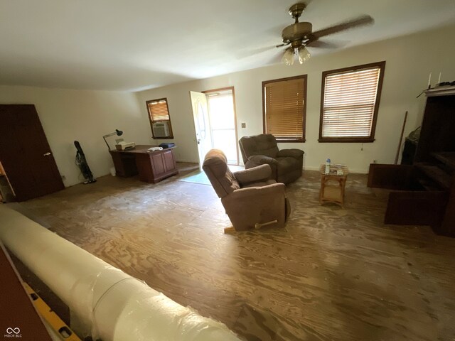 living room with hardwood / wood-style floors and ceiling fan