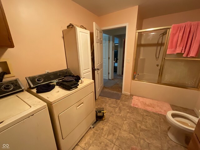 laundry room featuring washing machine and dryer