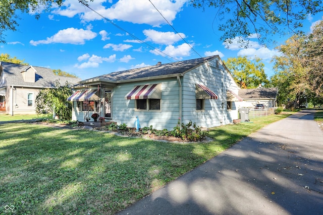 bungalow with a front yard