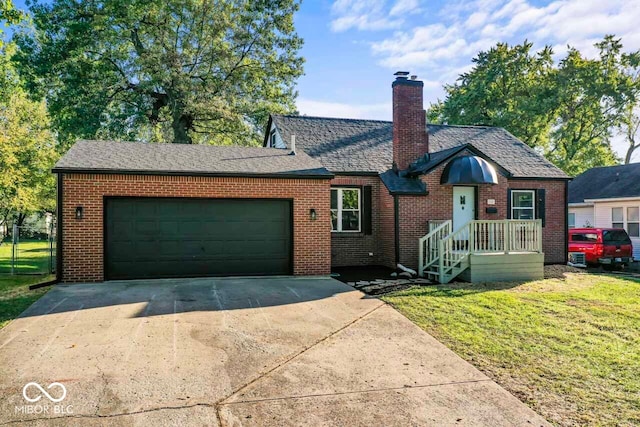 view of front of property with a front lawn and a garage