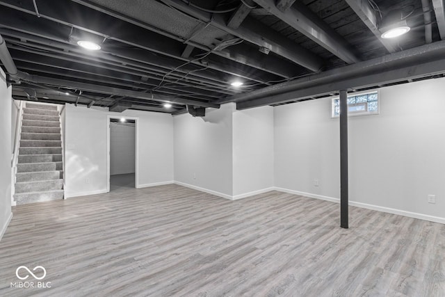 basement featuring wood-type flooring