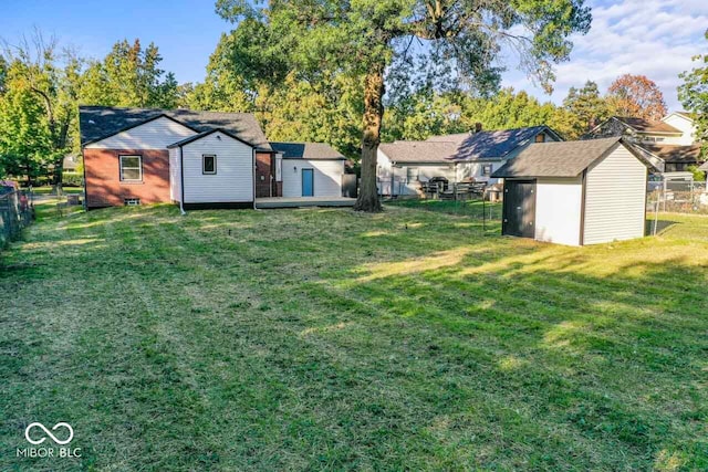 view of yard featuring a storage unit