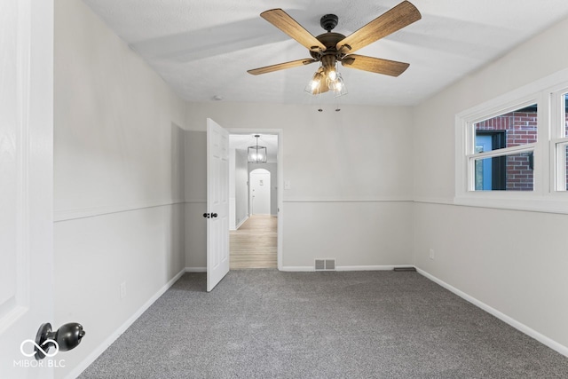 unfurnished bedroom featuring carpet flooring and ceiling fan