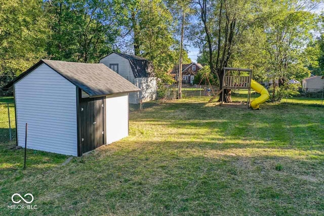 view of yard featuring a shed and a playground