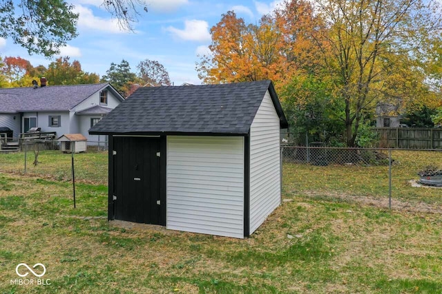 view of outbuilding featuring a yard