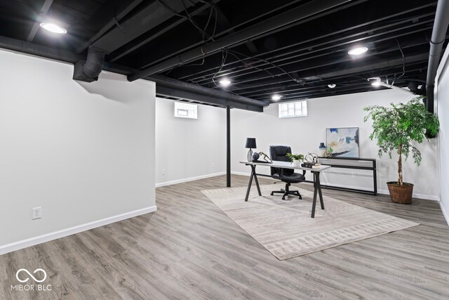 office with hardwood / wood-style flooring