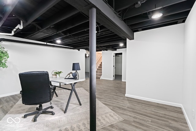 office space with wood-type flooring