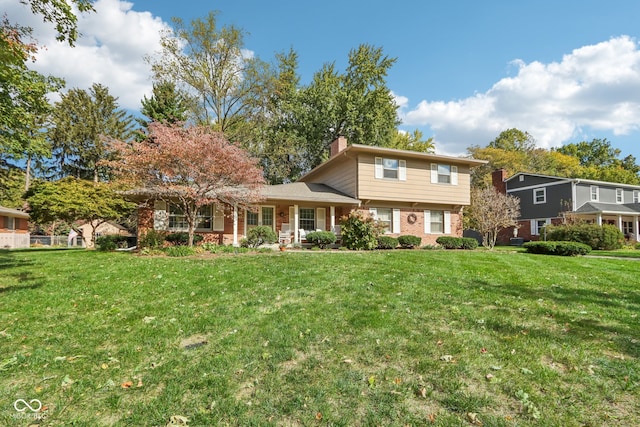 view of front of home with a front lawn