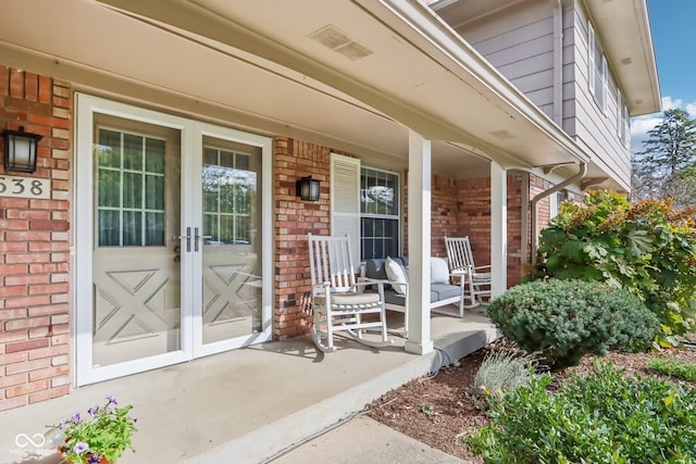 property entrance featuring covered porch