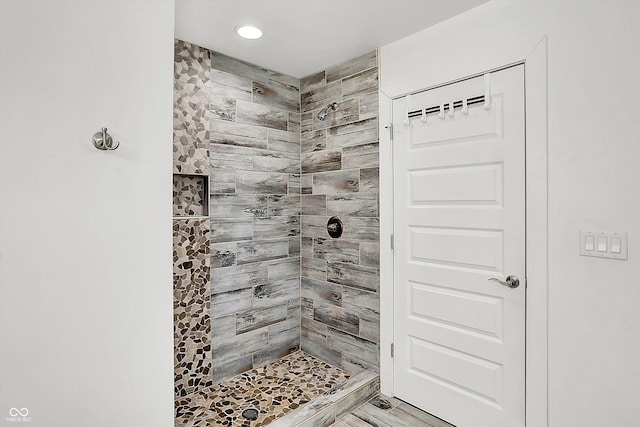 bathroom with a tile shower