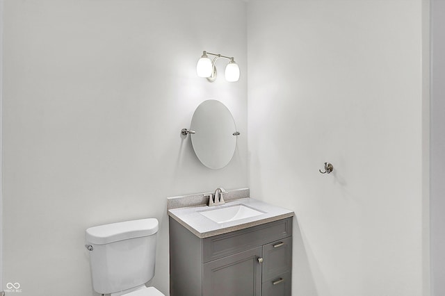 bathroom with toilet and vanity