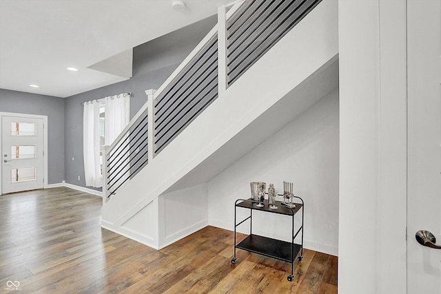 stairs with wood-type flooring