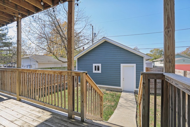 wooden deck featuring an outbuilding