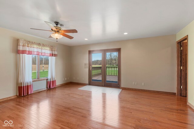 2831 S Hixon Rd S, Montezuma, IN 47862 - unfurnished room with light wood-type flooring, ceiling fan, recessed lighting, and baseboards