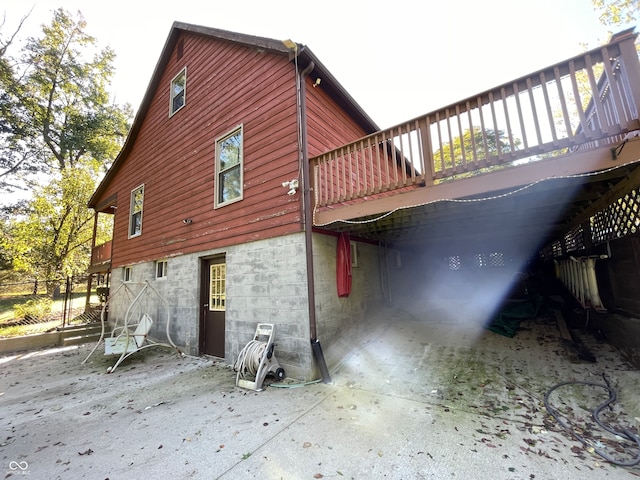 view of home's exterior with a deck