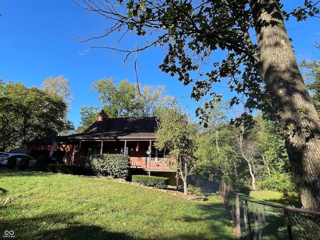 exterior space featuring a yard and a deck