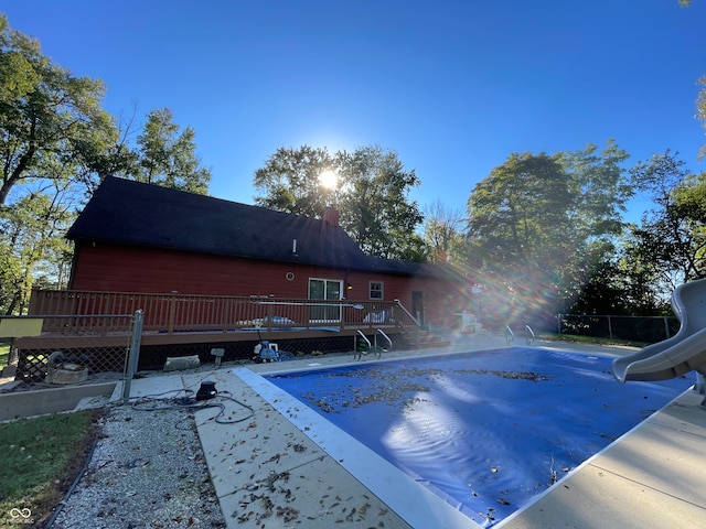 view of swimming pool with a patio and a wooden deck