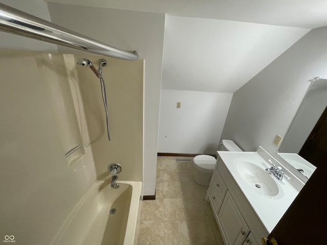 full bathroom with toilet, bathtub / shower combination, vanity, and vaulted ceiling