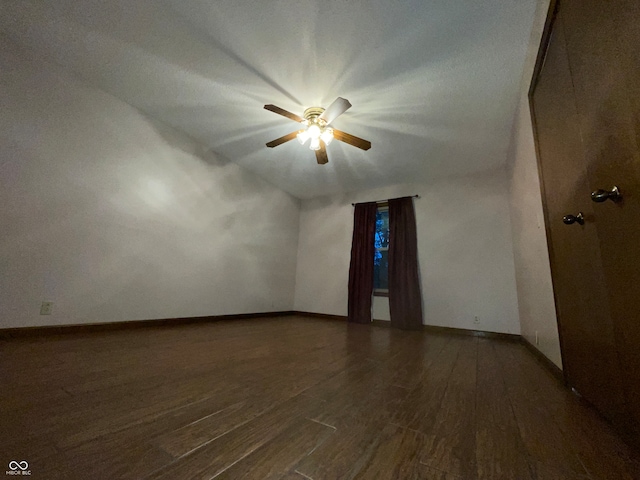 bonus room with dark wood-type flooring, ceiling fan, and vaulted ceiling