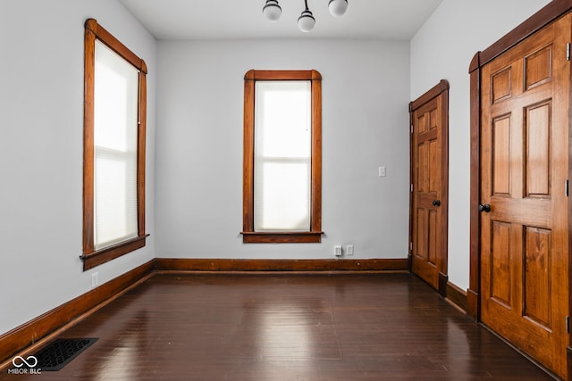 interior space with dark hardwood / wood-style floors