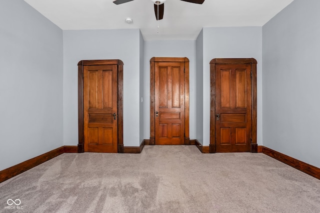 unfurnished bedroom featuring carpet flooring and ceiling fan