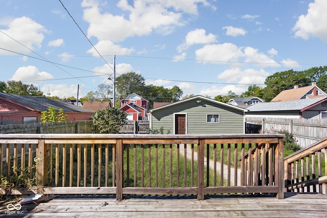 deck featuring a yard and a storage shed