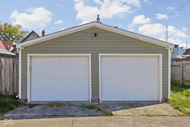 garage featuring wood walls