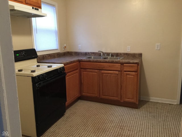 kitchen featuring sink and electric range