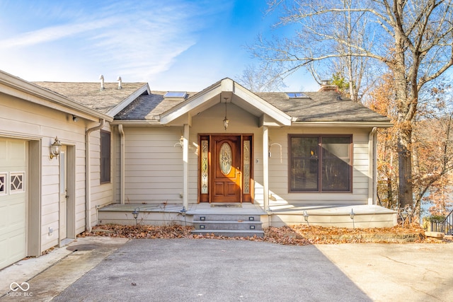 doorway to property featuring a garage