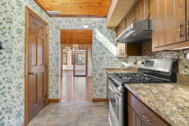 kitchen featuring stainless steel gas stove, wooden ceiling, an inviting chandelier, pendant lighting, and exhaust hood