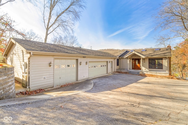 single story home with a garage