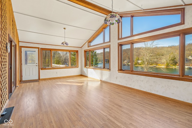 unfurnished sunroom with a water view and lofted ceiling with beams